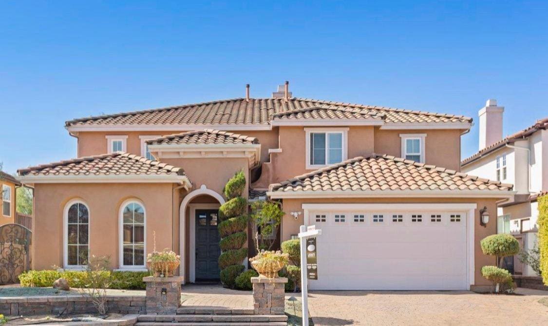 Full exterior, warm peach and tan